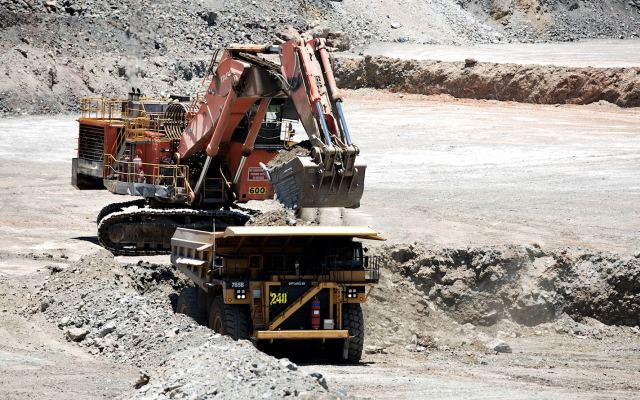 Stockpiled uranium mine loading truck